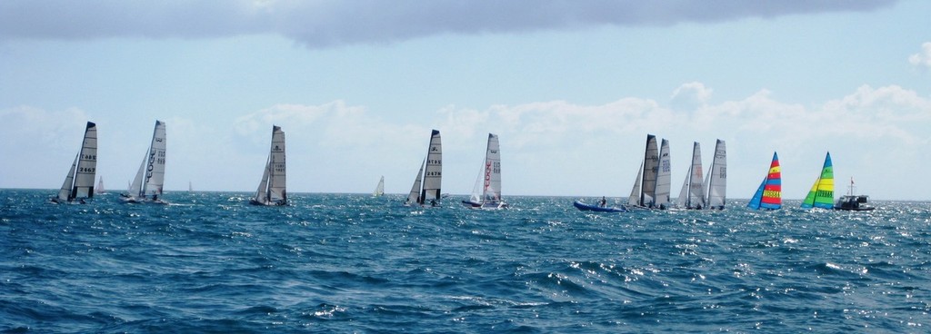Cool cats - The catamaran fleet purrs off the line, led by the big F18s. - Mandurah Easter Regatta © Antonio Stefano